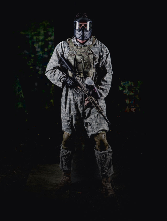 male paintball player in full flight suit and gear