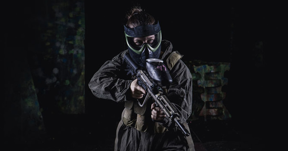 women in paintball getup