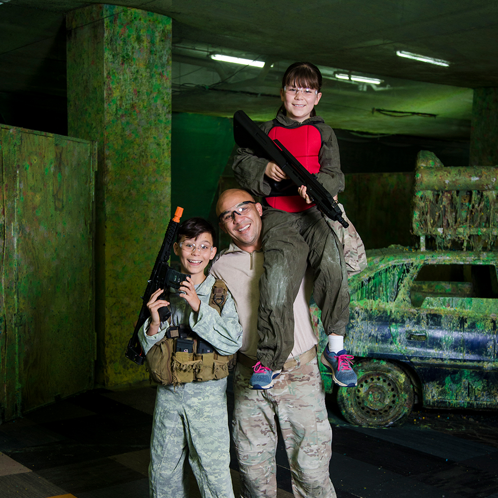 family in paintball gear